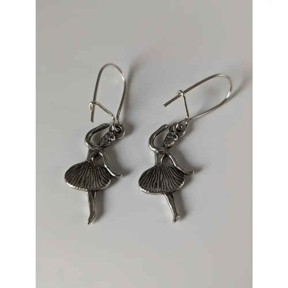 Silver steed ballet dancer dropped earrings featuring handmade silver with detailed tutu and classic hook clasps