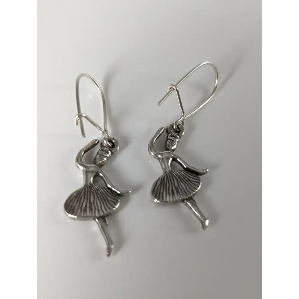 Silver steed ballet dancer dropped earrings featuring handmade silver with detailed tutu and graceful pose