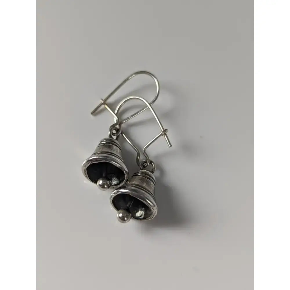 Silver steed bells handmade silver earrings with matte bell-shaped drops and small spherical accents at the bottom