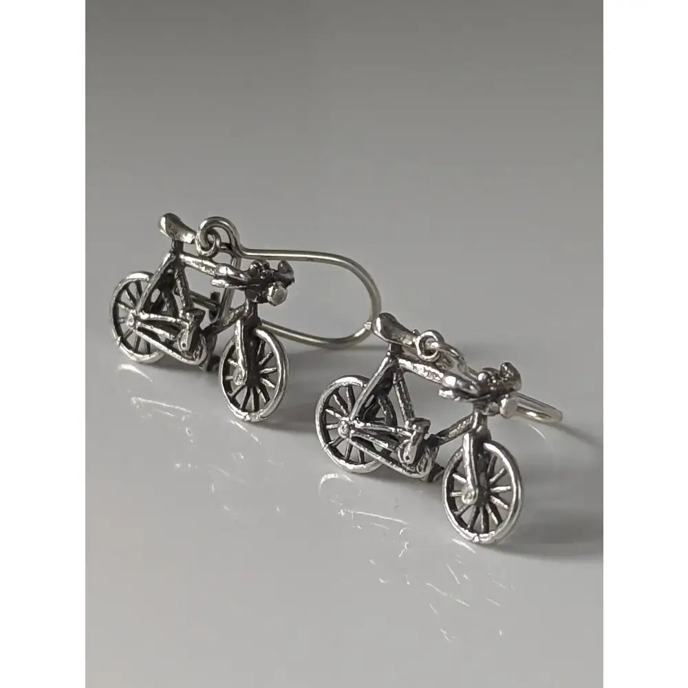 Silver steed bicycles handmade silver earrings shaped like bicycles with intricate detail and polished finish