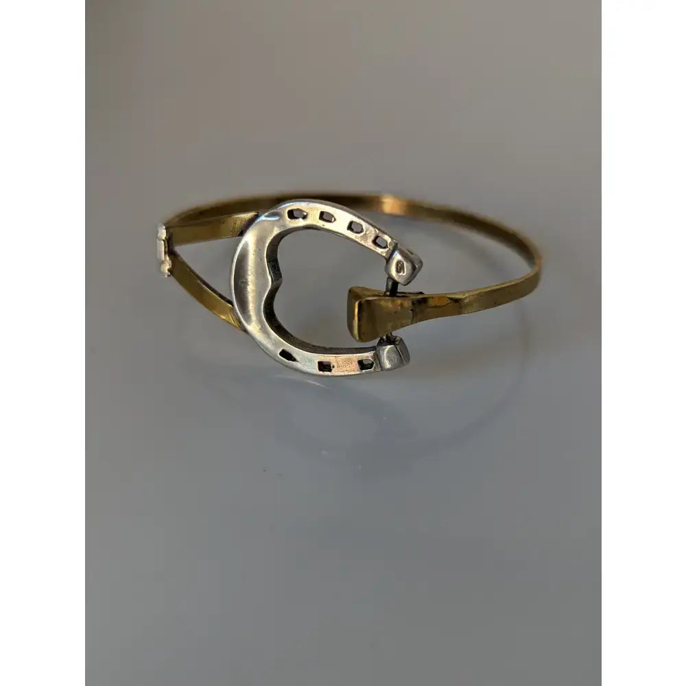 Silver steed big horseshoe bangle in gold tone with sterling silver inner band and black dot detailing