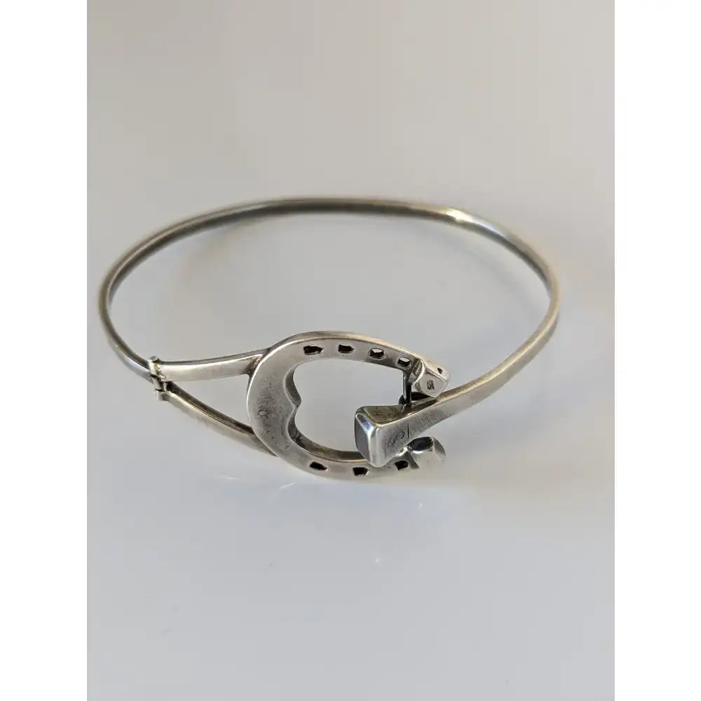 Silver steed big sterling silver horseshoe bangle bracelet with polished finish and small rectangular clasp