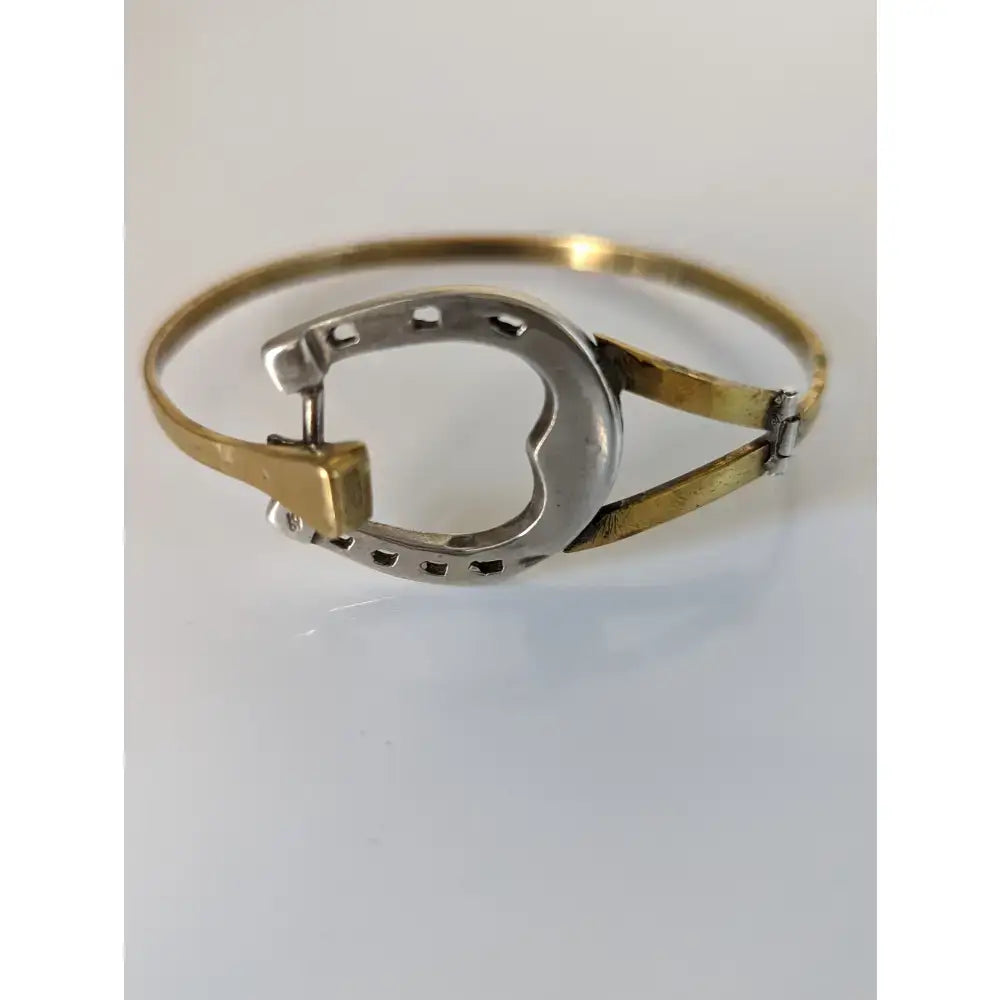 Silver steed big horseshoe bangle featuring a two-tone sterling silver and gold metal bracelet design