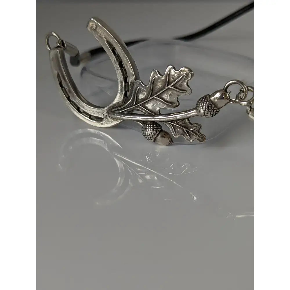 Silver steed big horseshoe pendant necklace with detailed oak leaves and acorns in silver on a cord equestrian necklace