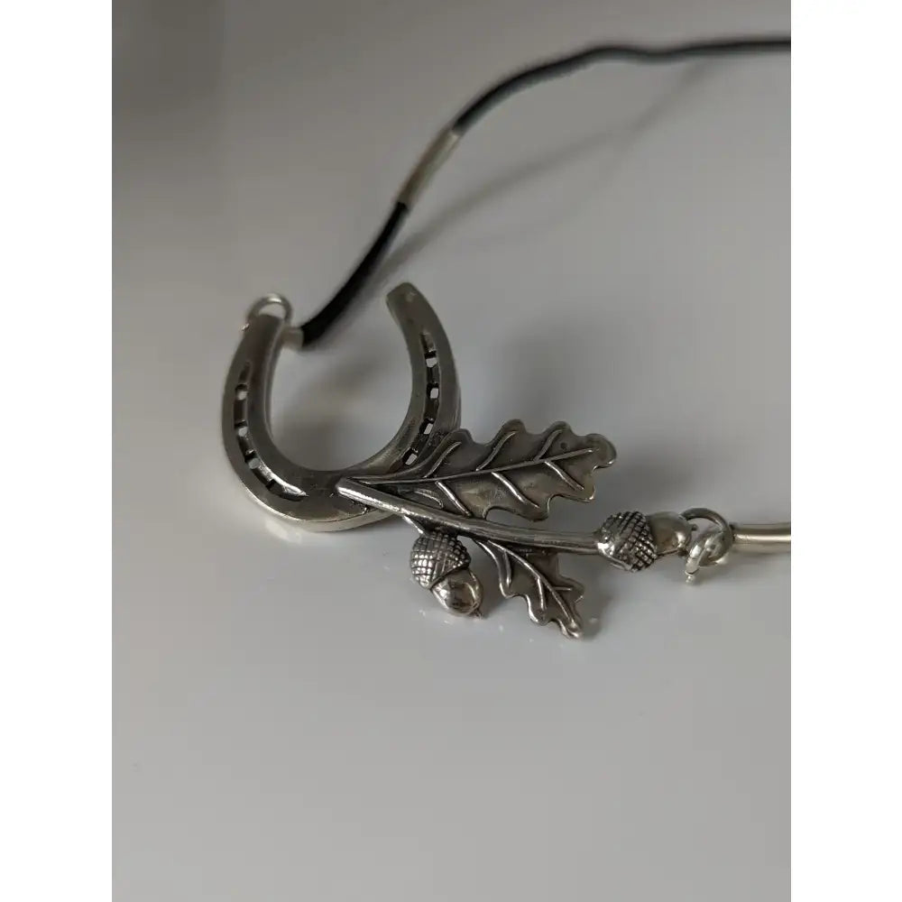 Silver steed big silver horseshoe pendant with detailed oak leaves and acorns on black cord equestrian necklace