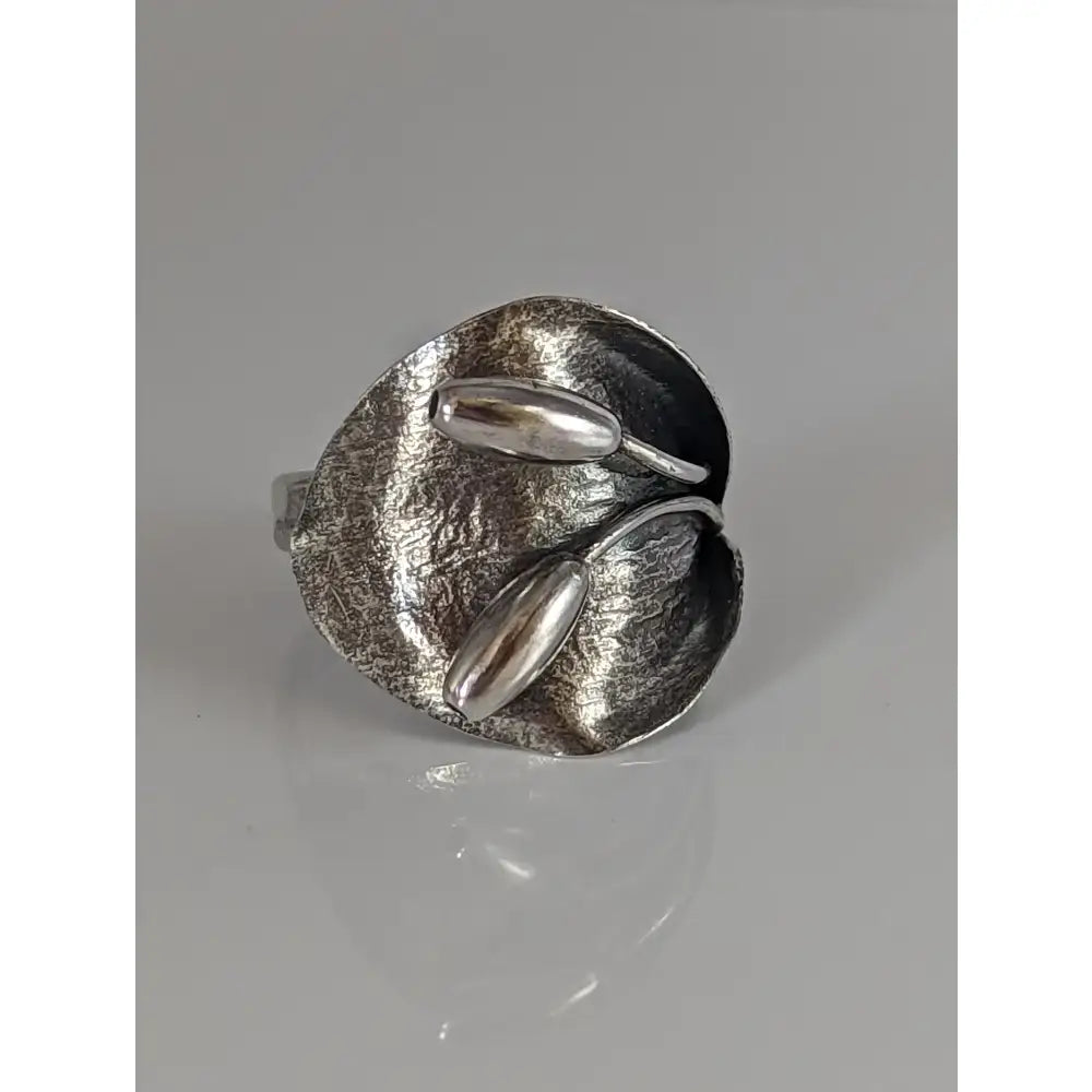 Silver steed big leaf ornament silver ring with textured sterling silver leaf and polished seed accents