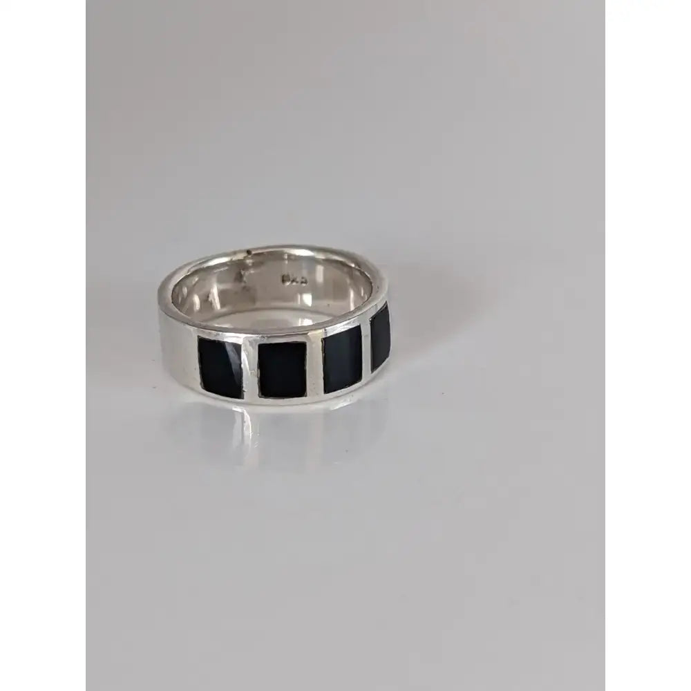 Silver steed black mass silver band with four rectangular black inlays on a sleek polished silver ring perfect for equestrian jewelry