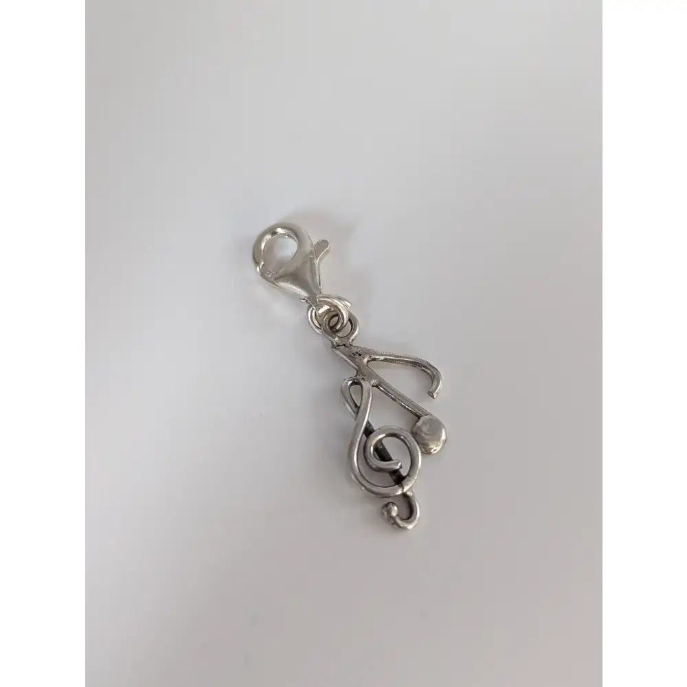 Silver steed clef & note silver charm featuring a treble clef design and lobster clasp for easy attachment