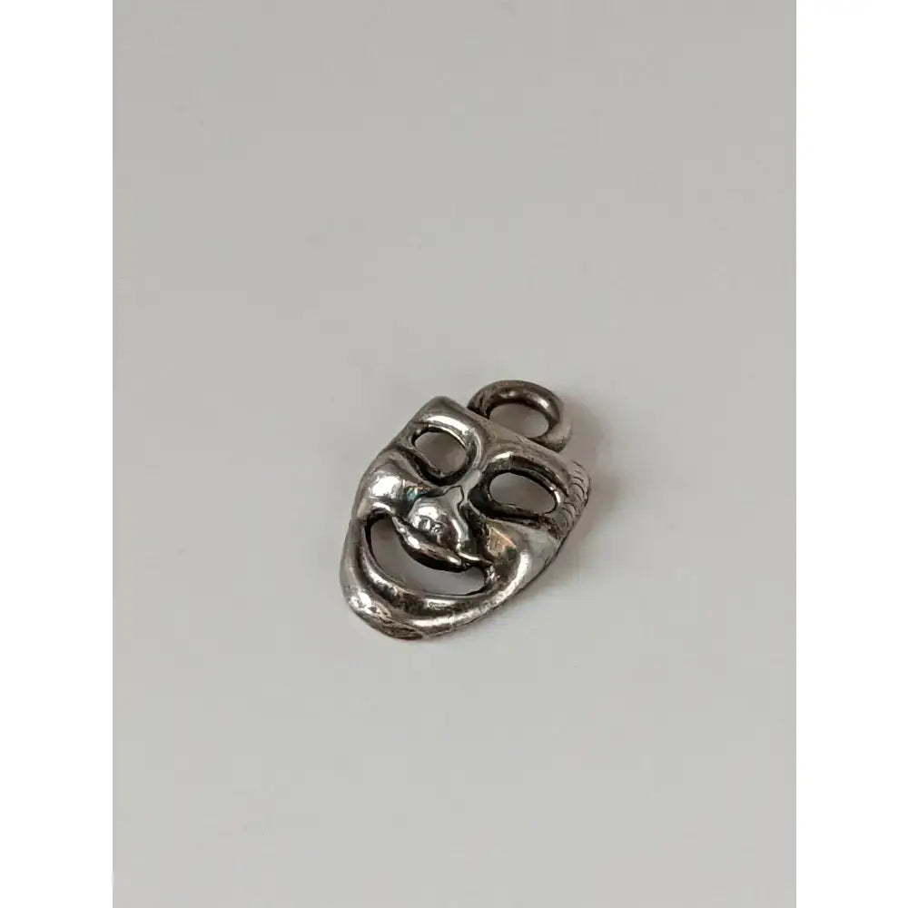 Silver steed comedy silver pendant featuring a sterling silver detailed theater mask charm with loop for wearing