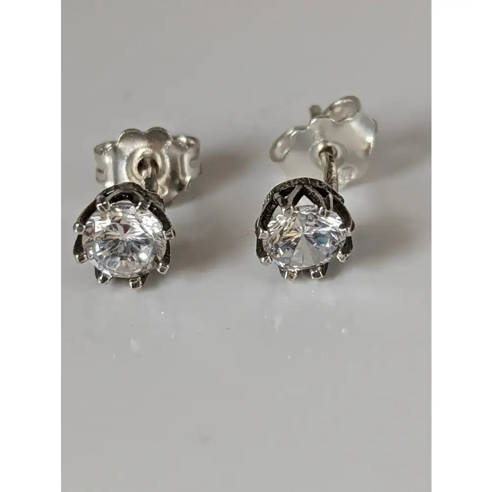 Silver steed crystal crown stud earrings with clear round-cut gemstones in a delicate silver metal frame