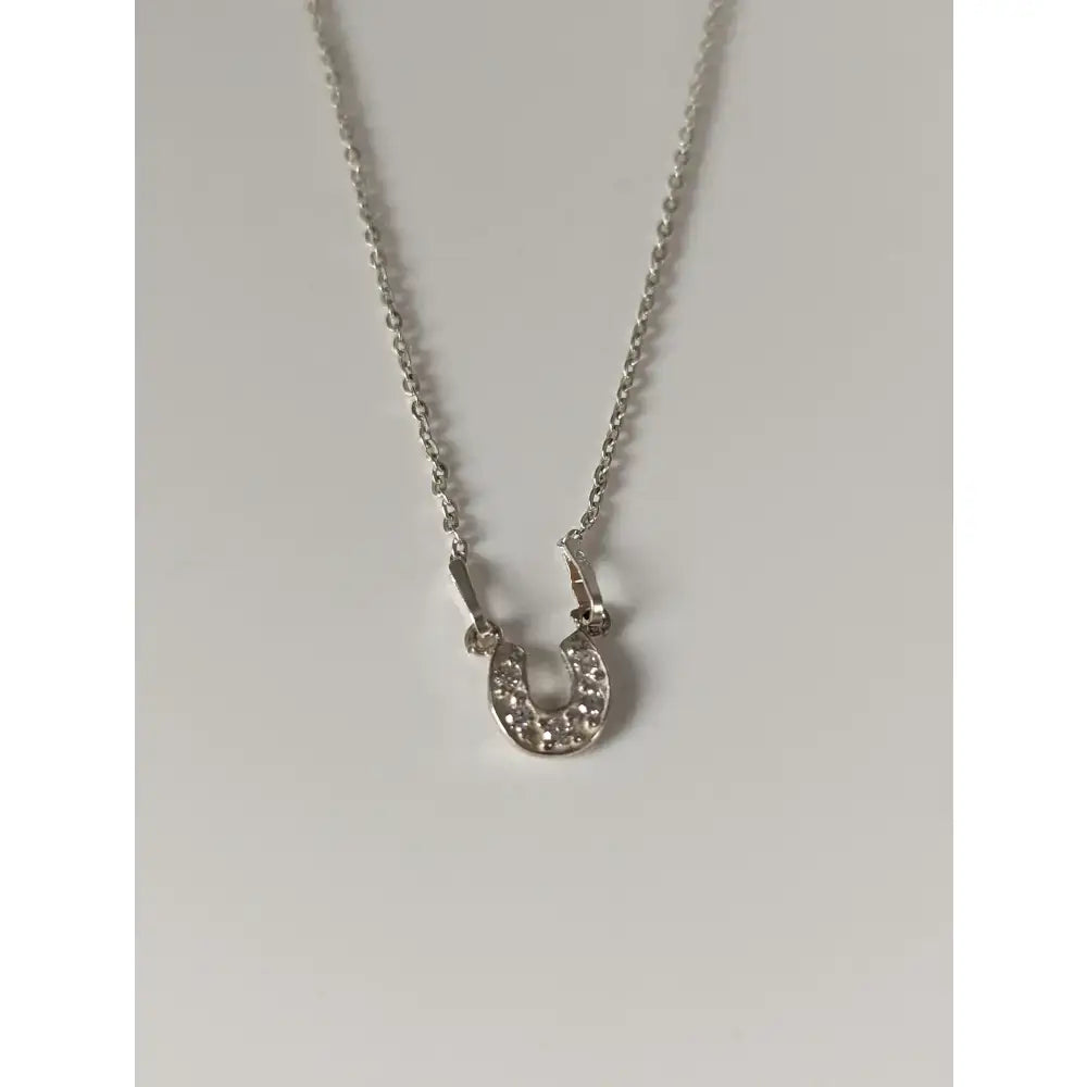 Silver steed crystal horseshoe necklace with clear crystal embellishments in a silver pendant, perfect equestrian jewelry