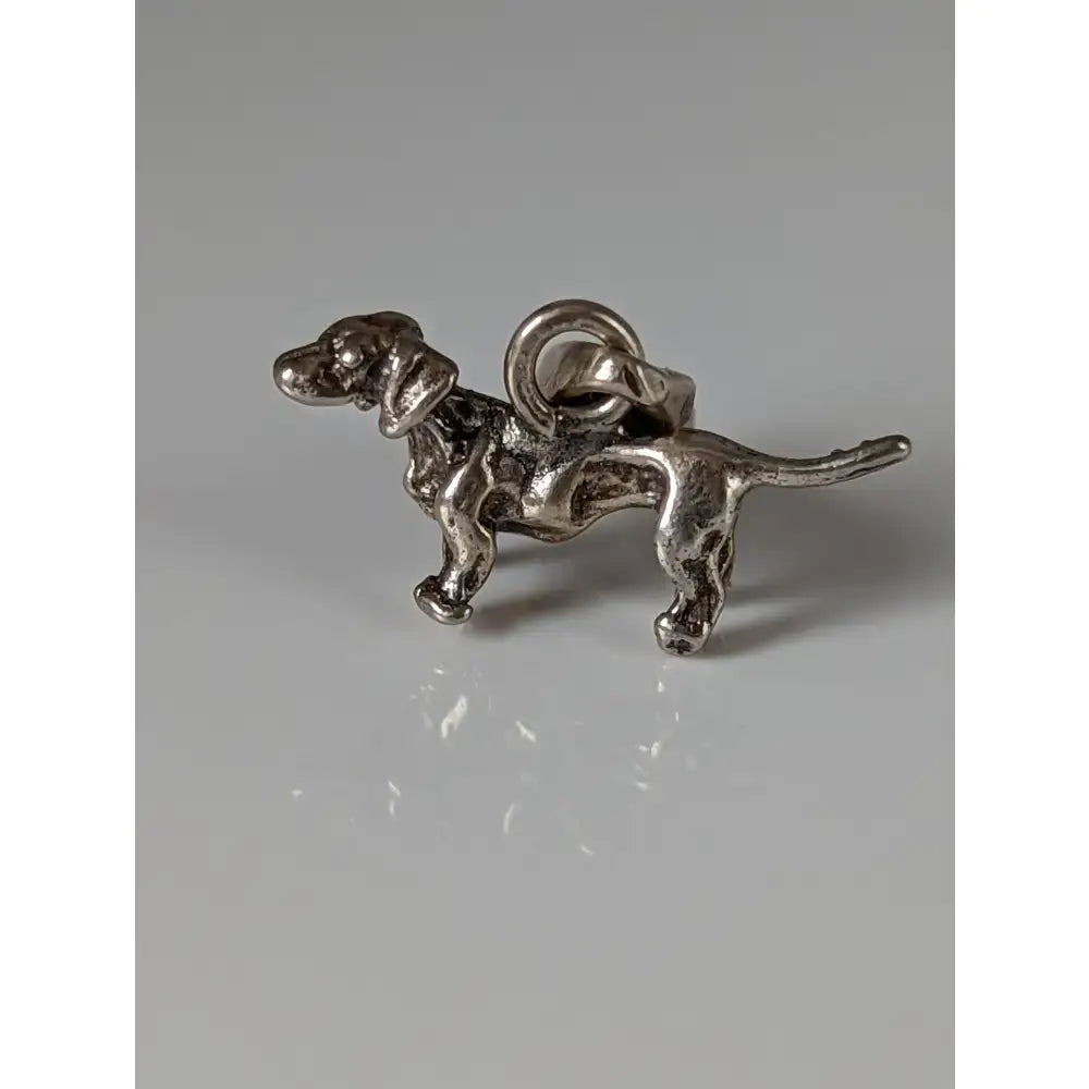 Silver steed dachshund silver pendant featuring a detailed standing silver-colored metal dog charm with attachment loop