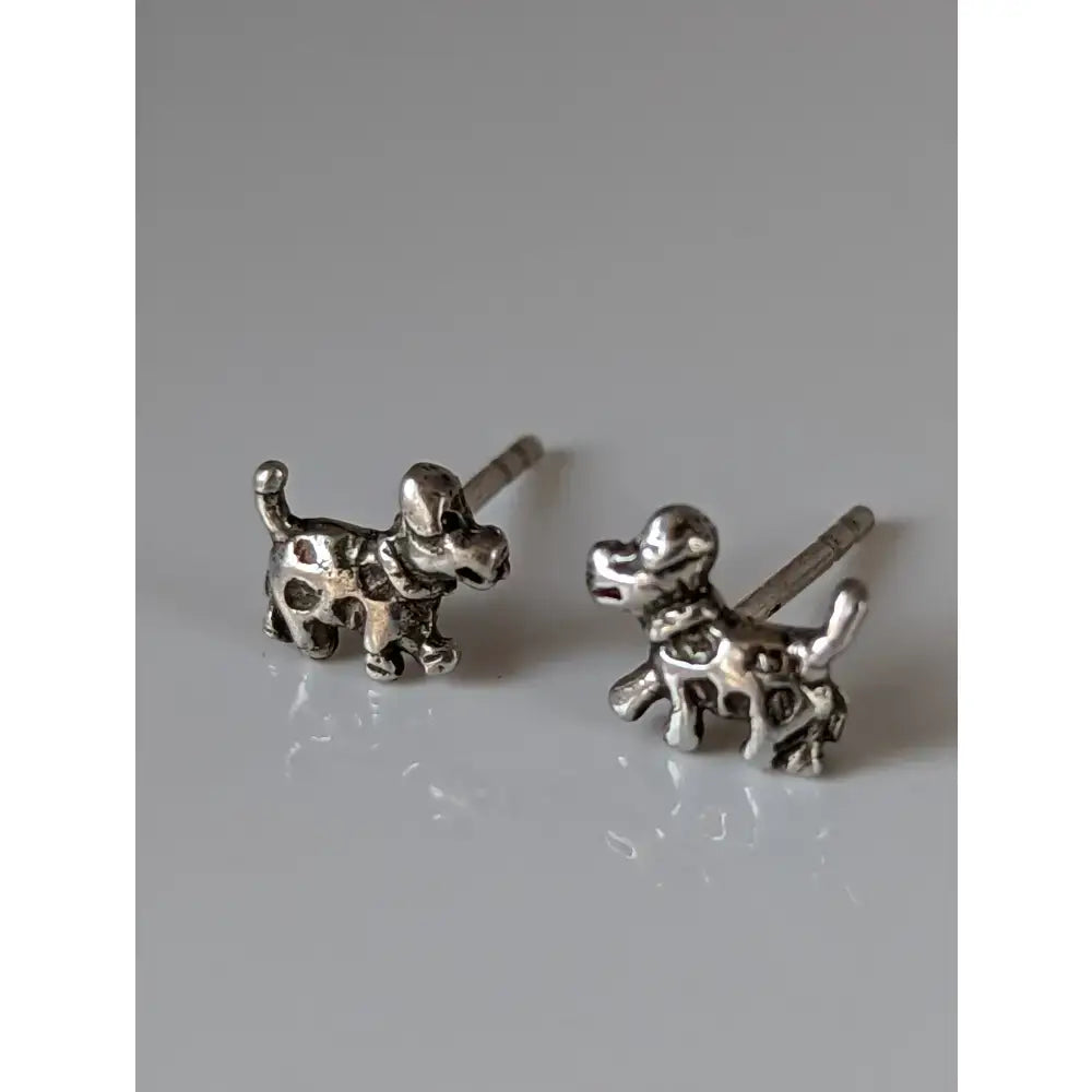 Silver steed dalmation silver stud earrings shaped like playful spotted puppies with polished silver finish