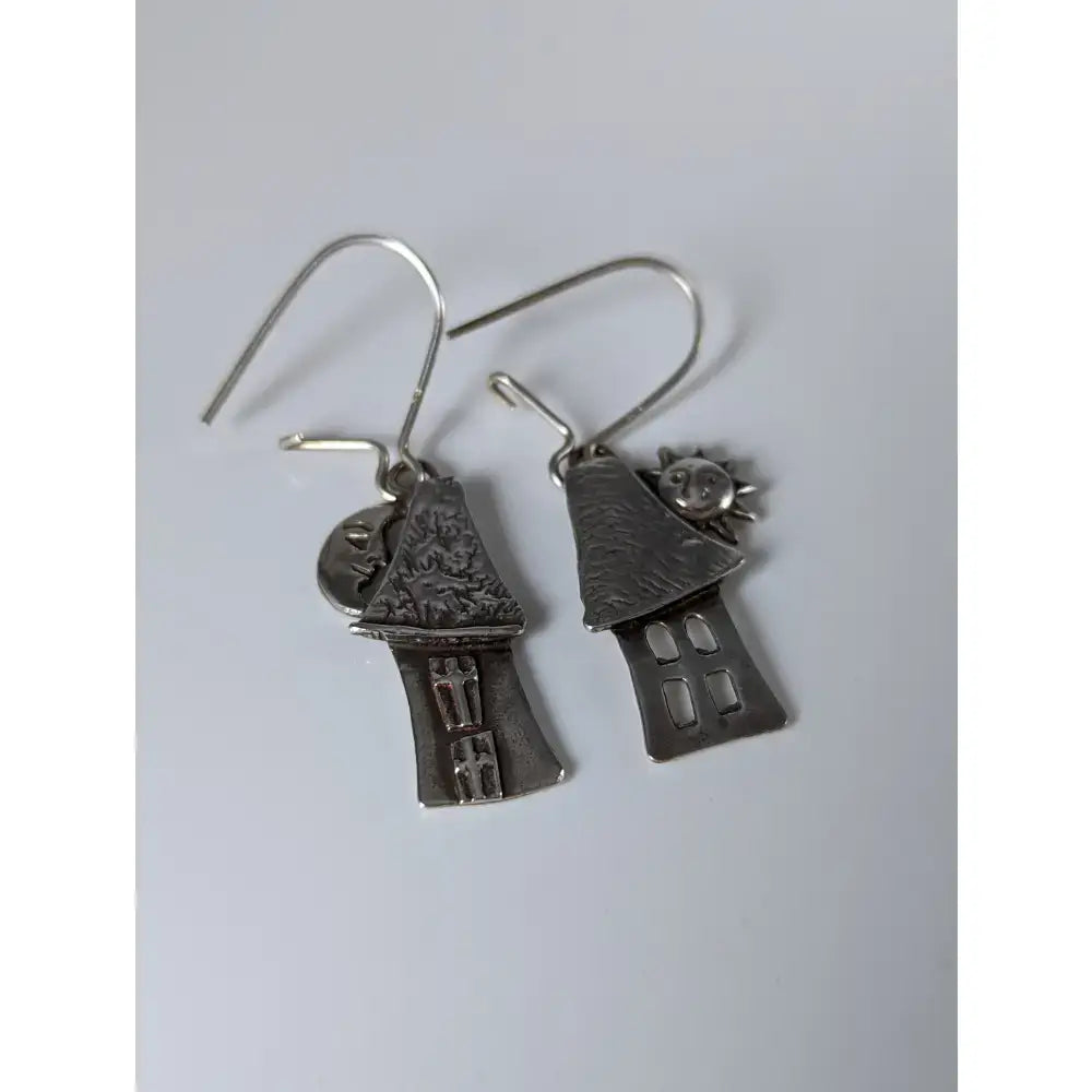 Silver steed day night house dropped earrings featuring silver-toned detailed house shapes with sun and moon charms