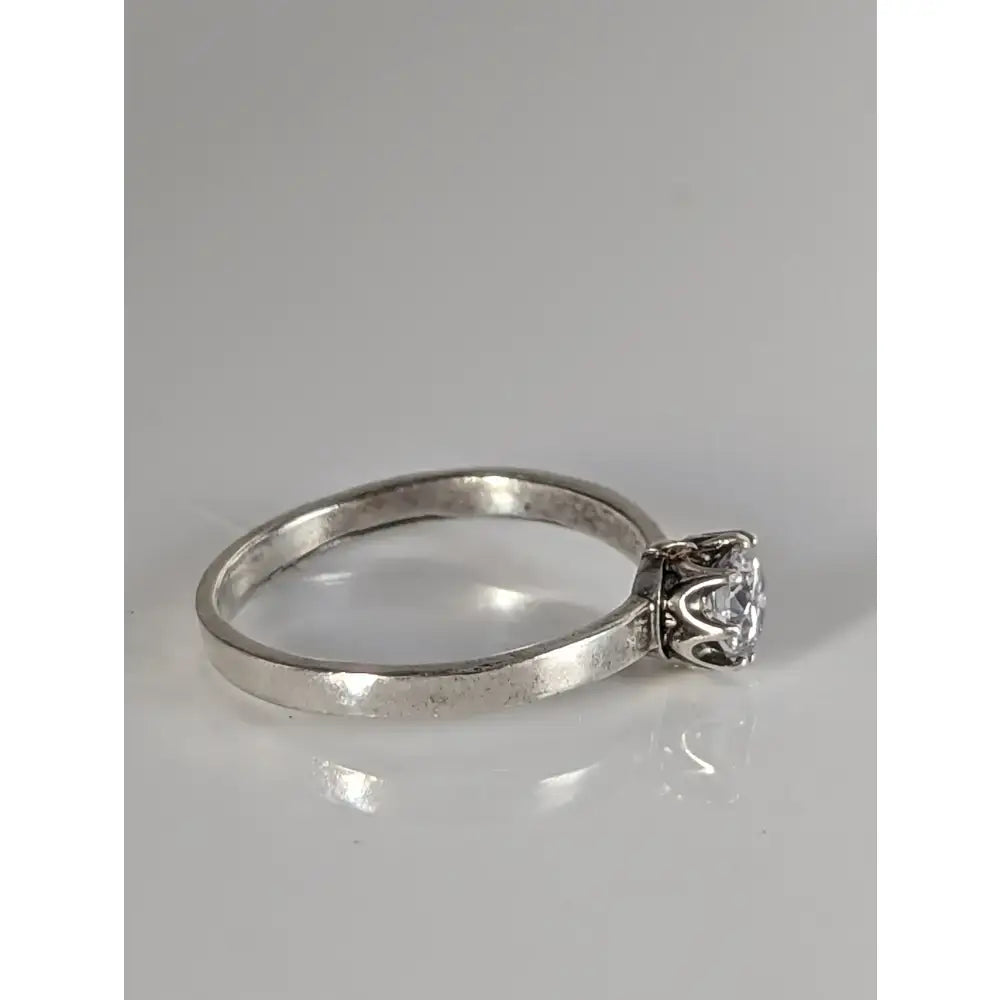 Silver steed delicate unique silver zirconia ring with a round-cut diamond in an ornate vintage-style prong setting