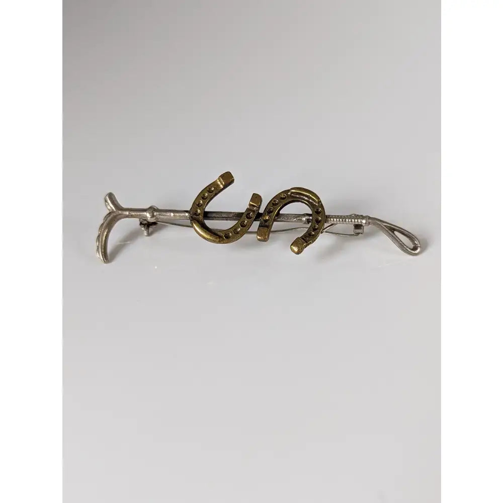 Silver steed double horseshoe-shaped tie clip with textured handmade silver and gold finish cane brooch design