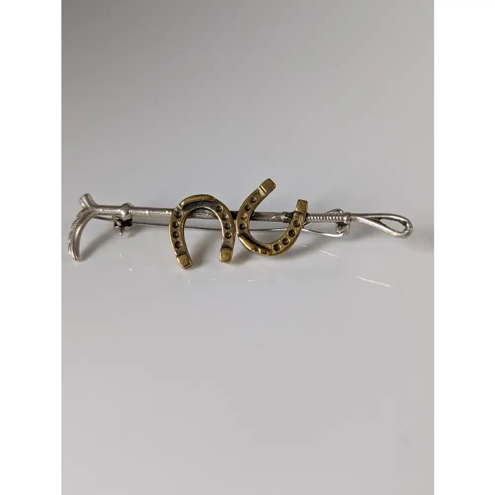Silver steed double handmade silver horseshoe tie bar with gold accents and dark stones for cane brooch use