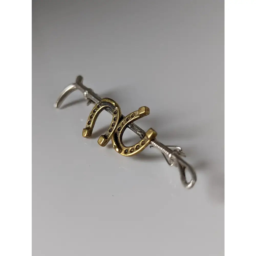 Silver steed double handmade silver cane brooch with interlocking gold and silver horseshoe designs for stock tie use