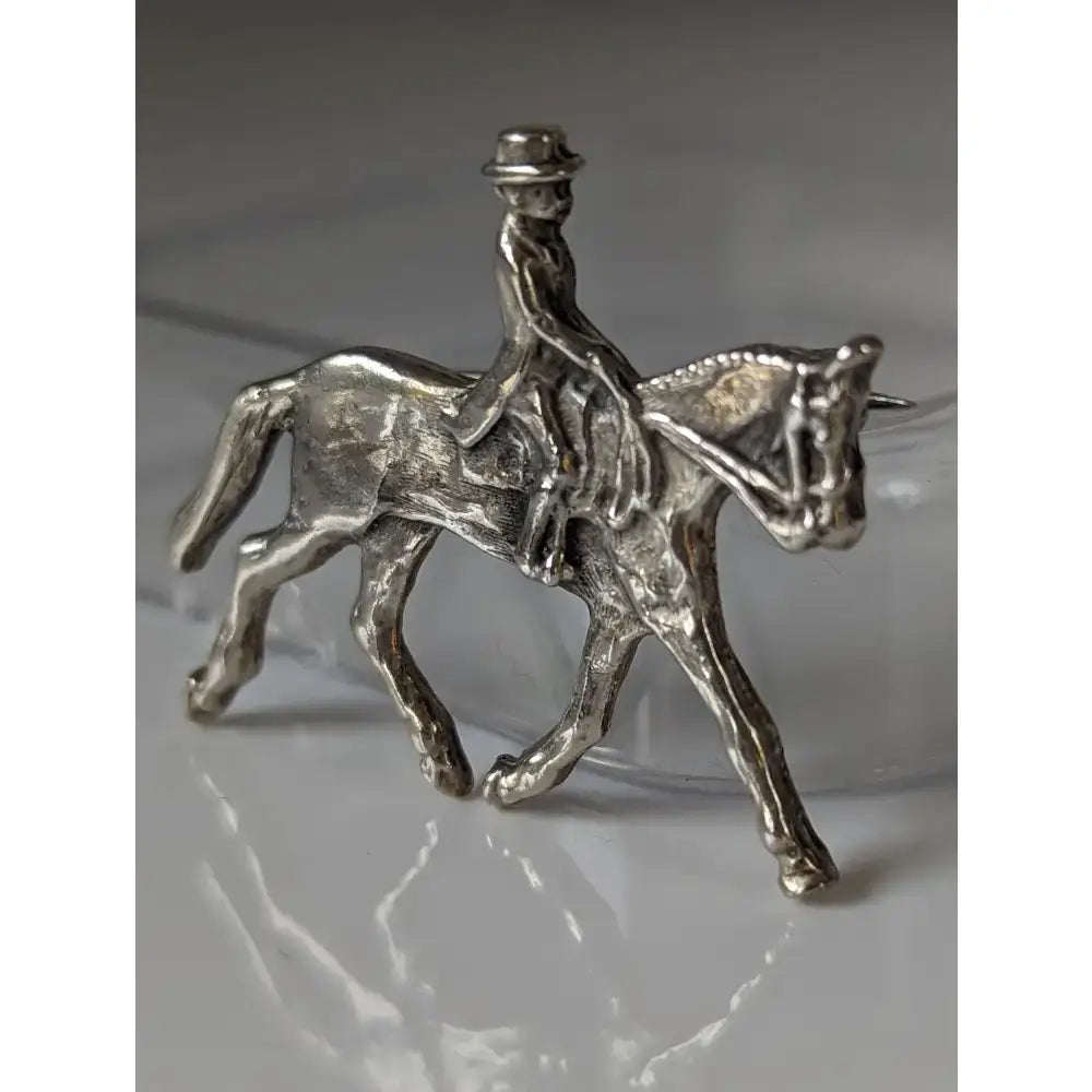 Silver steed dressage handmade silver brooch stock tie pin showing a rider in a hat on a detailed horse design
