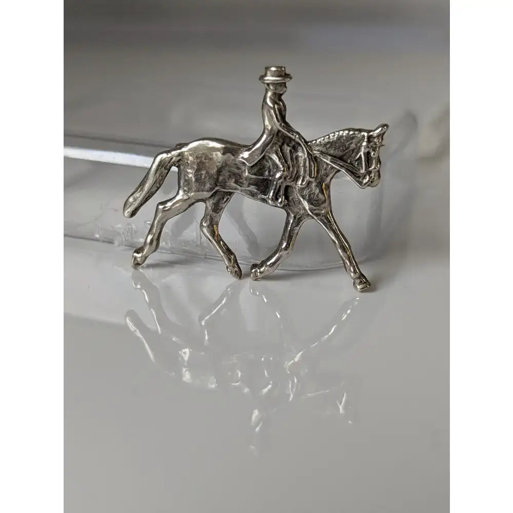 Silver steed dressage brooch stock tie pin featuring a handmade silver horse and rider with intricate detailing