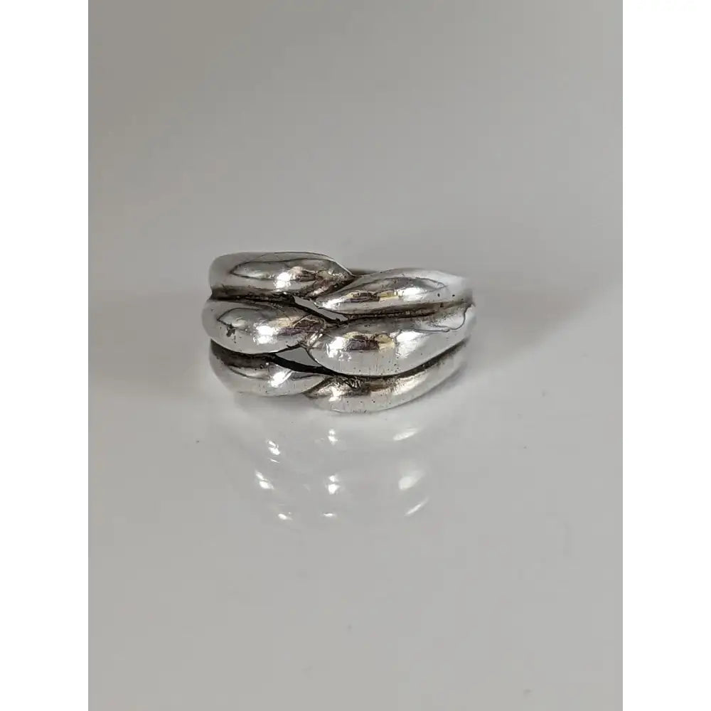 Silver steed ear grain silver ring featuring a textured silver knot design with an interwoven pattern