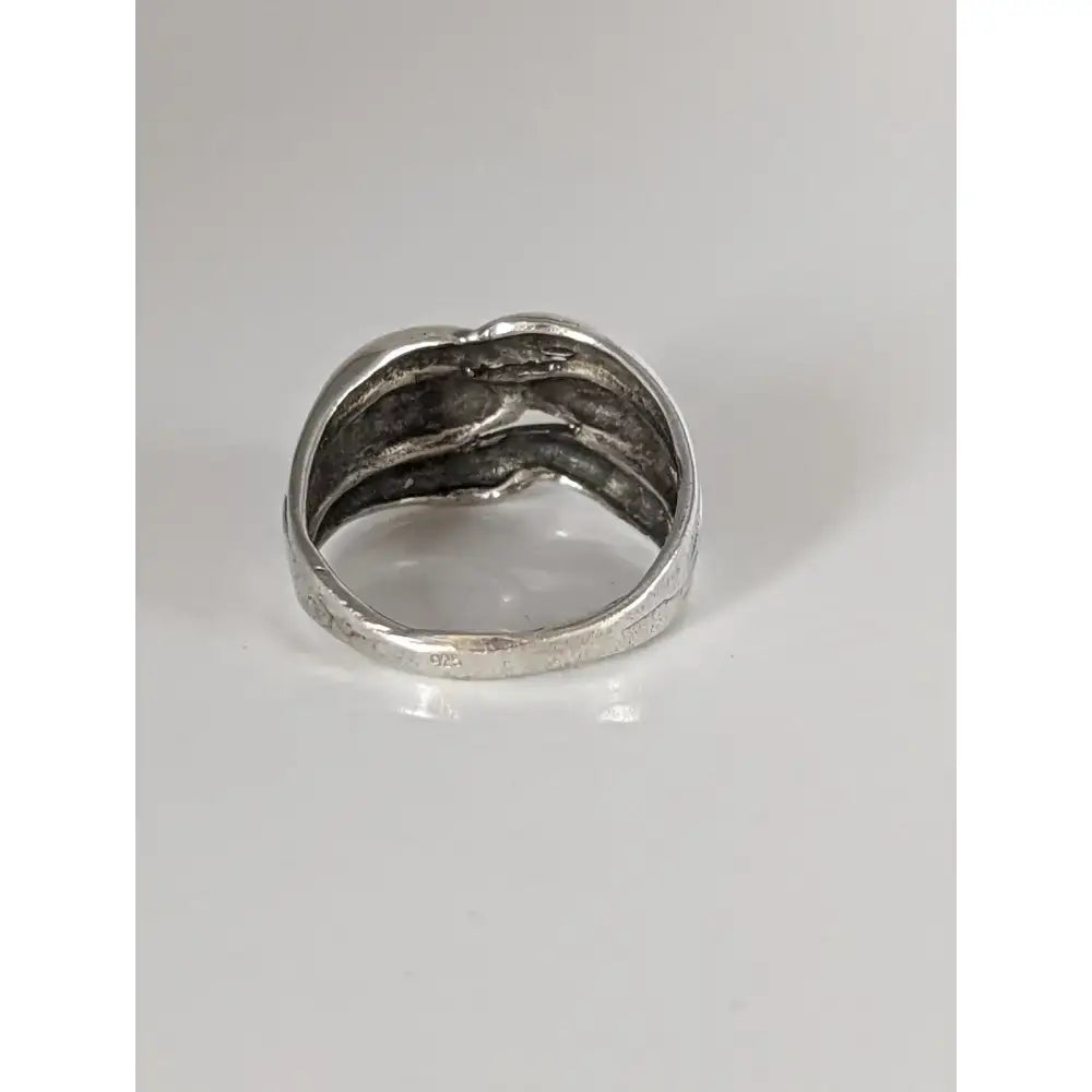 Silver steed ear grain silver ring with a textured sculptural design featuring intertwined silver-toned bands