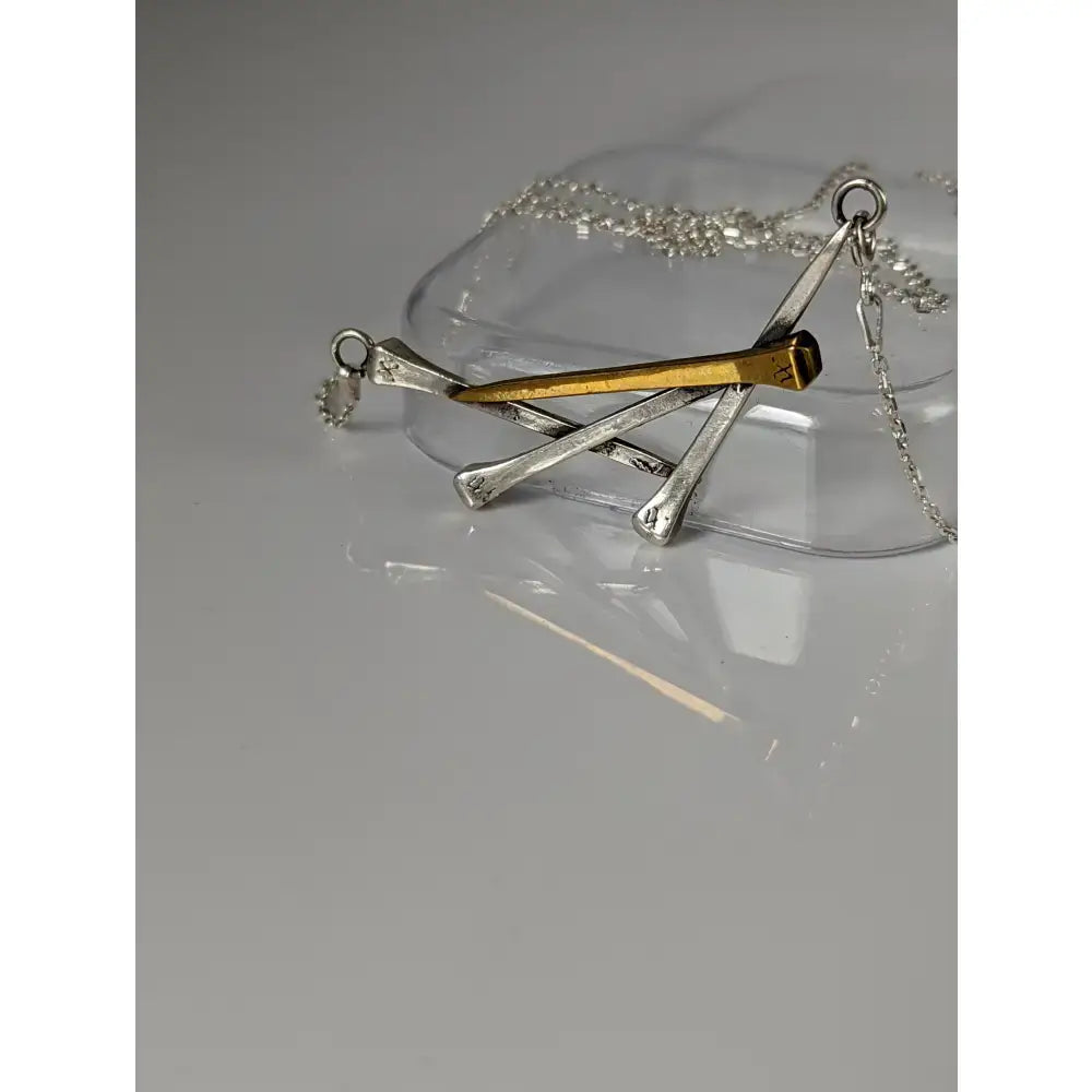 Silver steed elegant hoof nails necklace with silver and gold nail pendant on a chain
