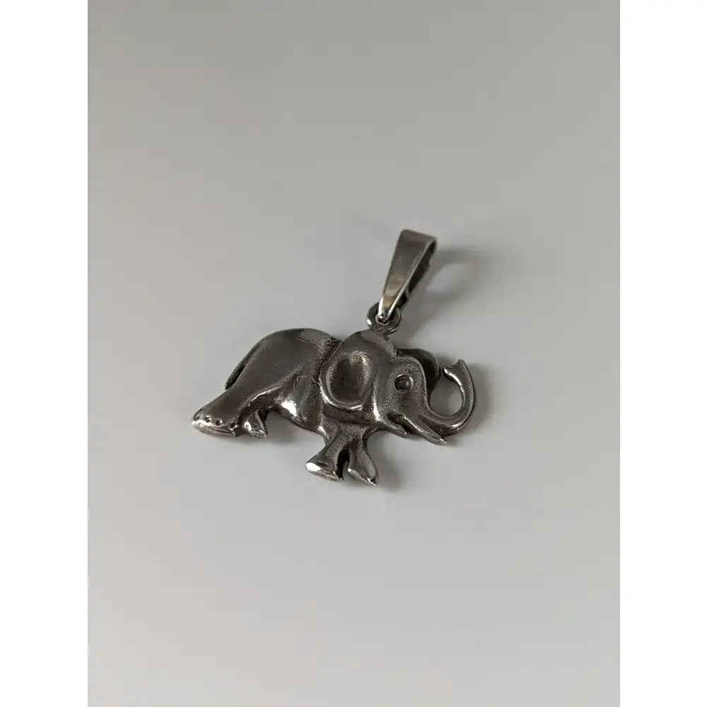 Silver steed elephant silver pendant with detailed sculpted features and polished metallic finish in silver