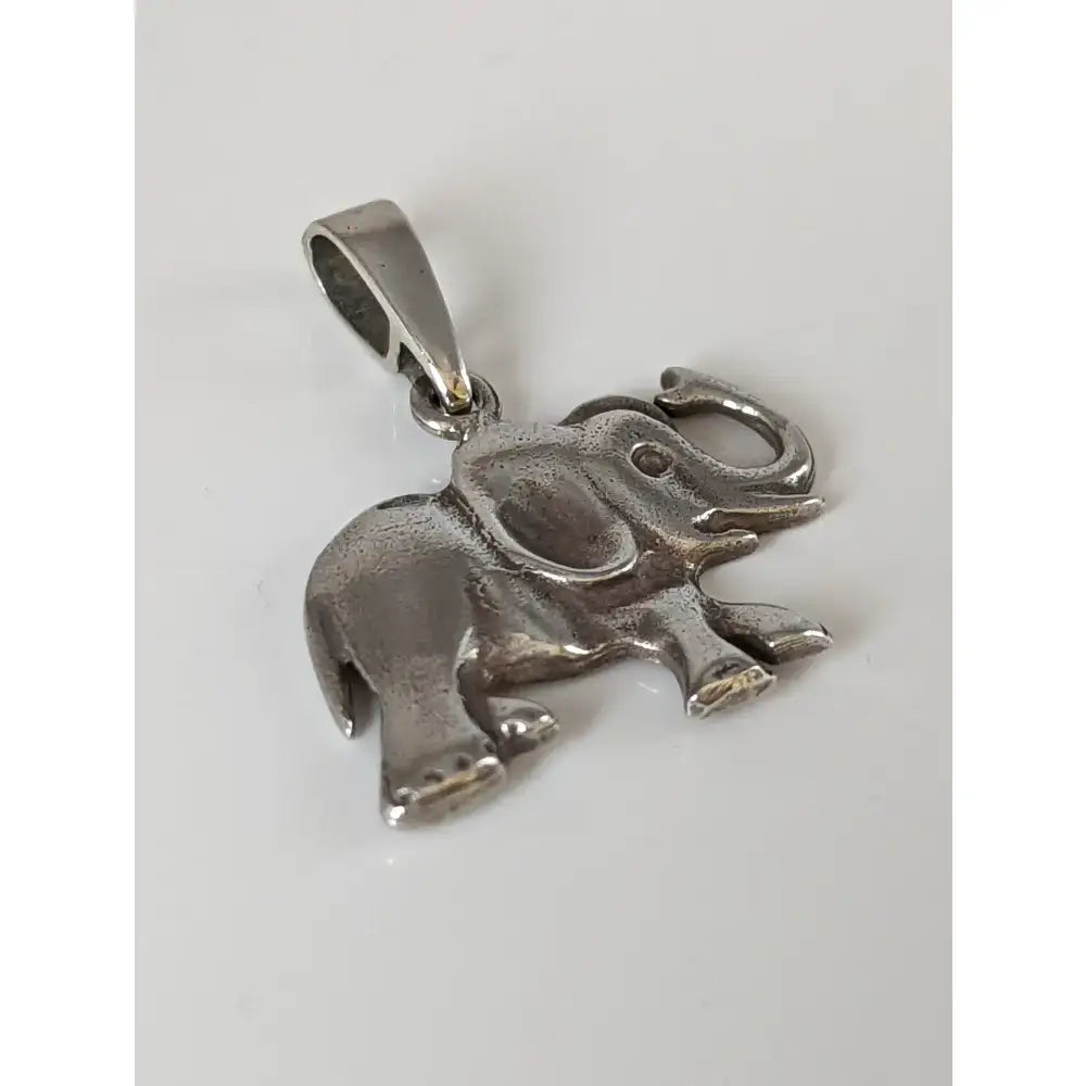 Silver steed elephant silver pendant featuring a polished textured finish with raised ears and a curled trunk design