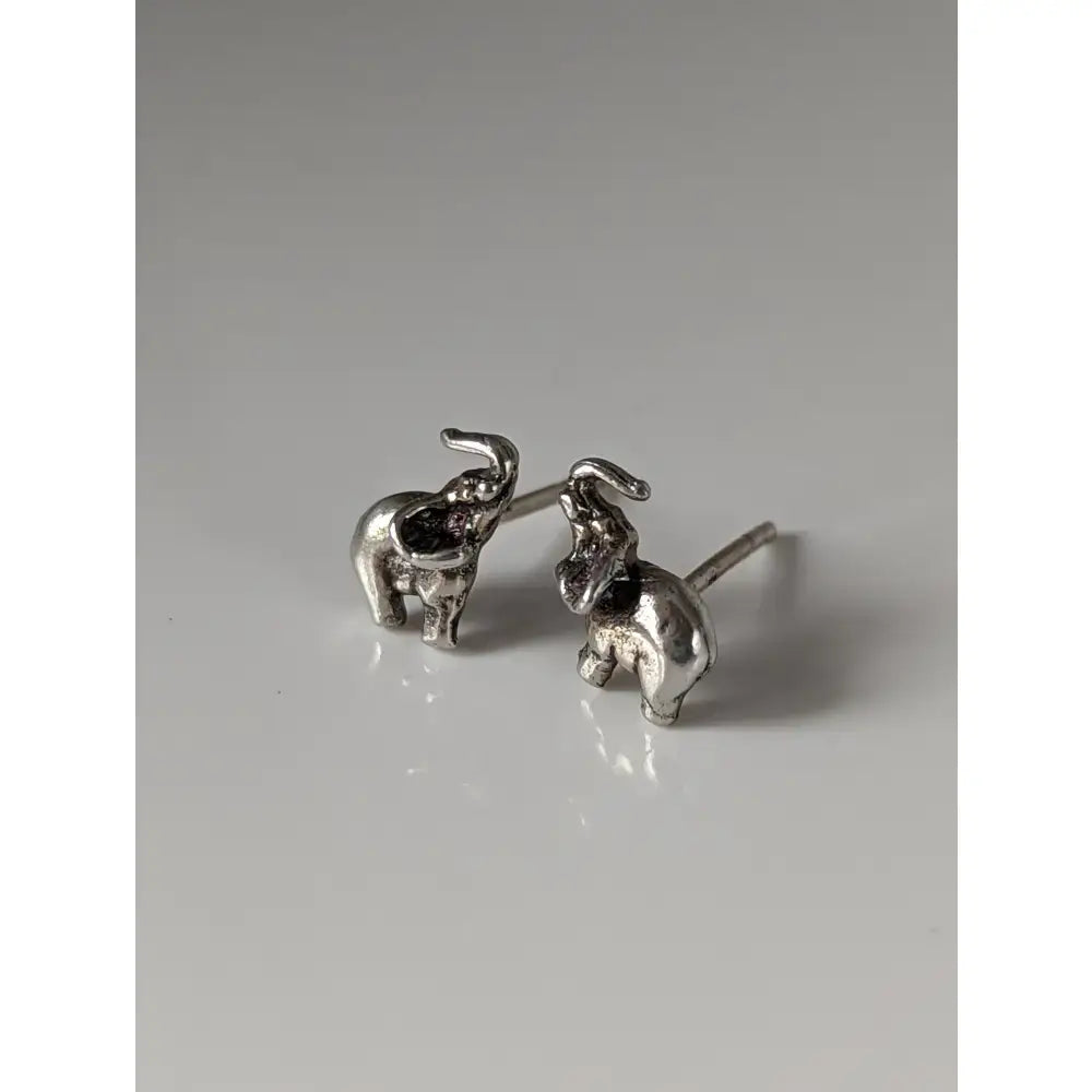 Silver steed elephant stud earrings featuring detailed craftsmanship and polished silver metallic finish