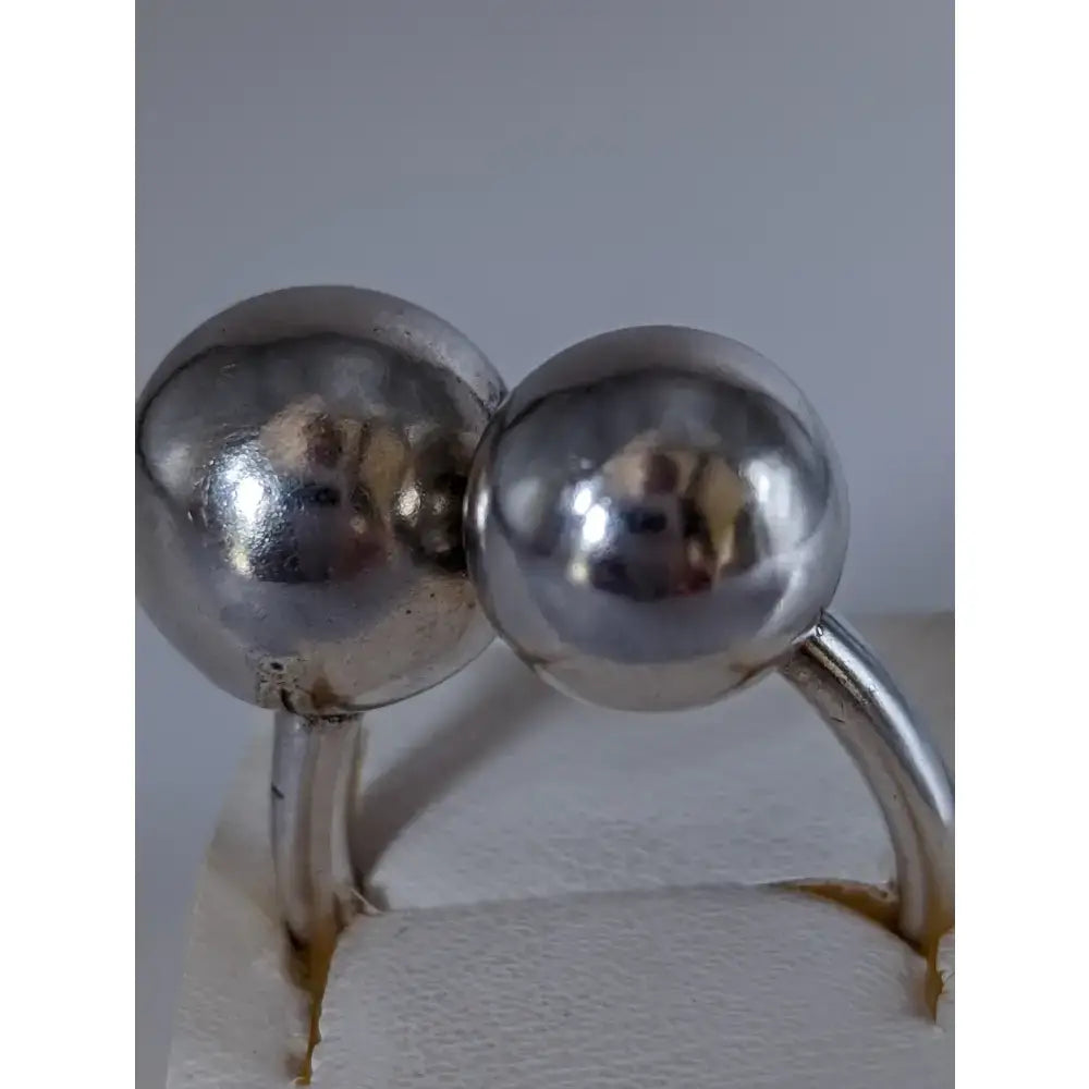 Silver steed extra large balls ring with two polished silver spheres connected by a sleek curved band perfect for equestrian jewelry