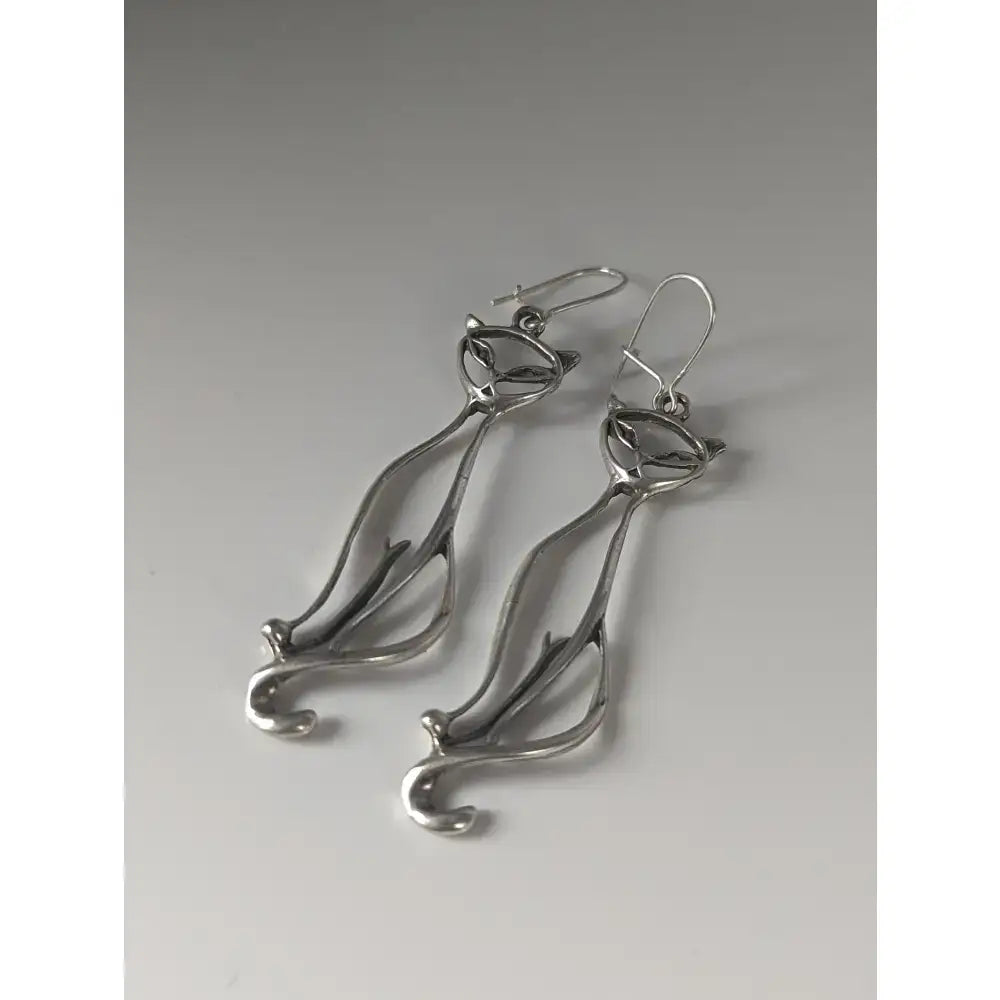 Silver dropped earrings featuring a sleek silver steed feline silver design with a polished metallic finish