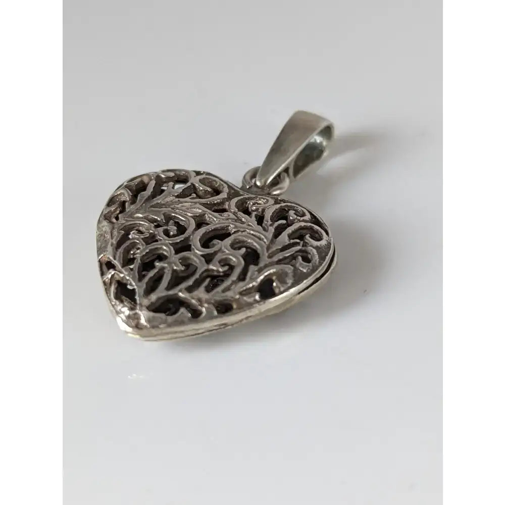Silver steed filigree heart silver pendant featuring a handmade silver filigree locket with polished finish