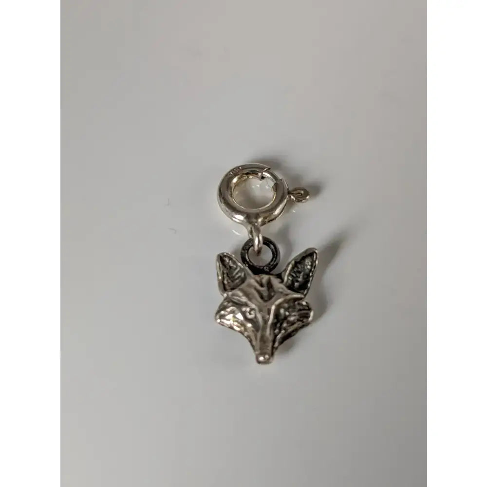 Silver steed fox head silver charm with detailed face and pointed ears on clasp perfect for equestrian jewelry