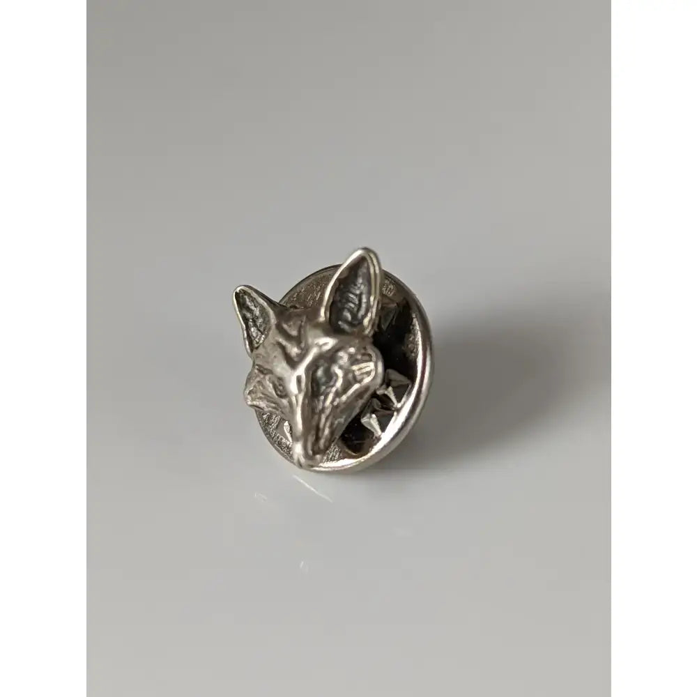 Silver steed fox head silver pin with detailed facial features and pointed ears made from shiny silver material