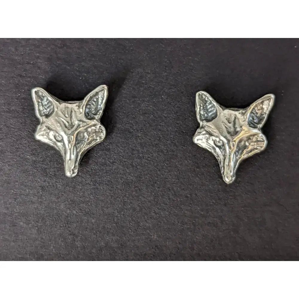 Silver steed fox head stud earrings featuring detailed silver fox head studs with textured ears and facial features