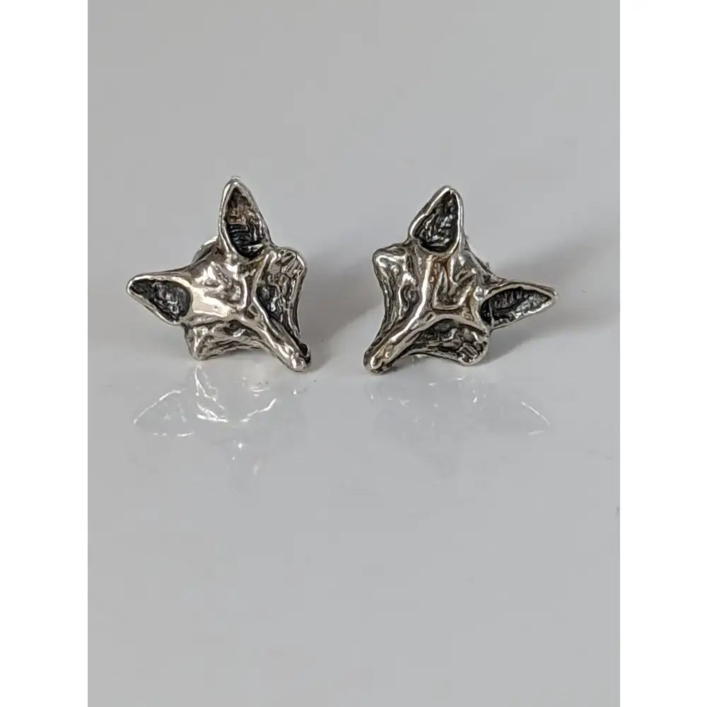 Silver steed fox head stud earrings in silver with textured handcrafted details resembling a fox head stud design
