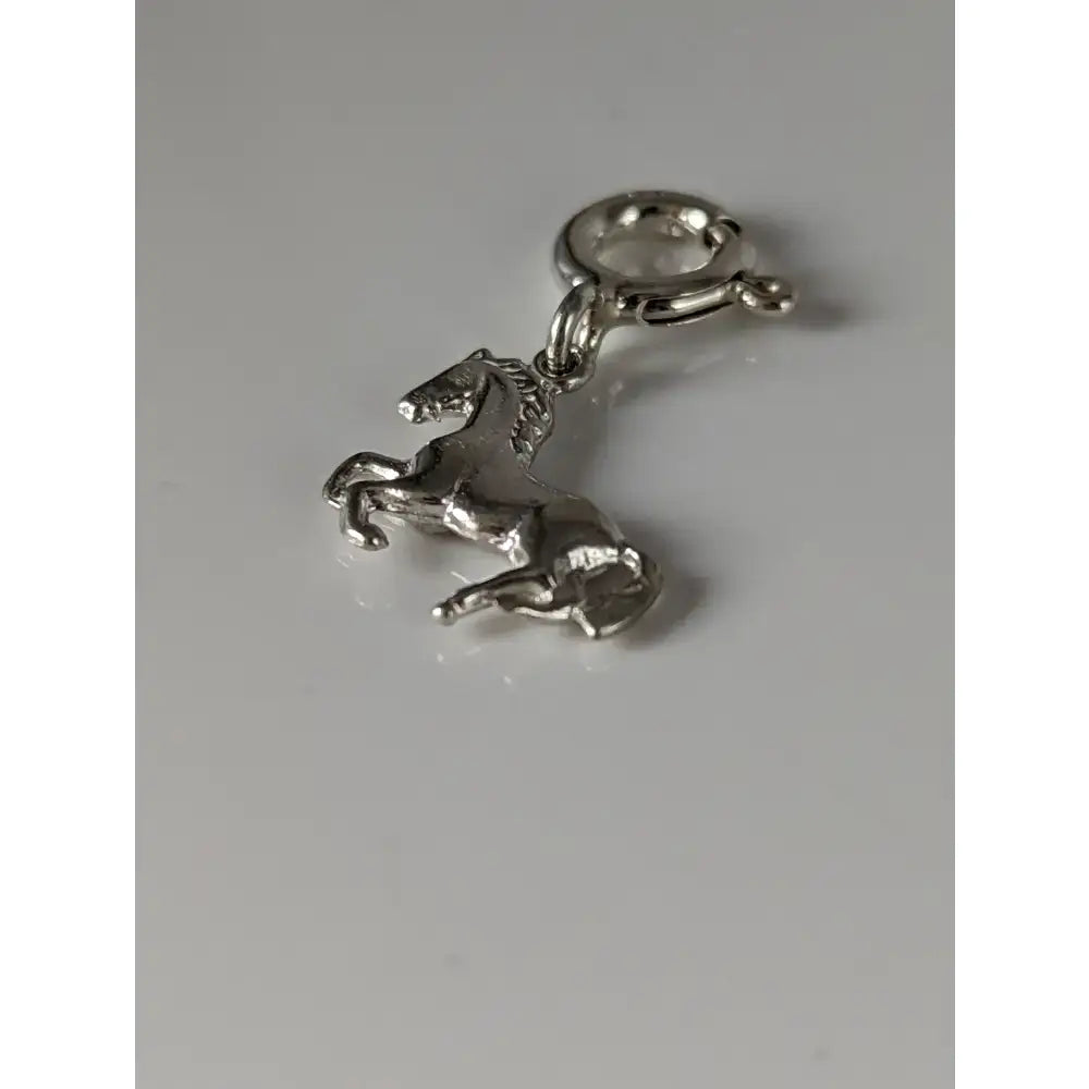 Silver steed galloping horse 2 silver charm with detailed sculpted features and polished metallic finish