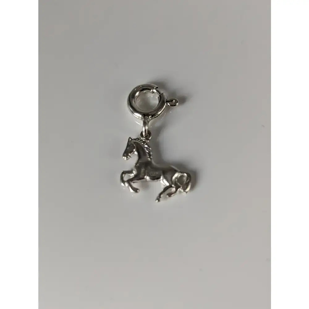 Silver steed galloping horse silver charm with polished metallic finish and detailed sculpted features