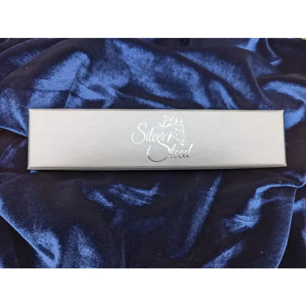 Silver rectangular gift box with silver steed logo and horse emblem in elegant cursive for silver steed gift boxes