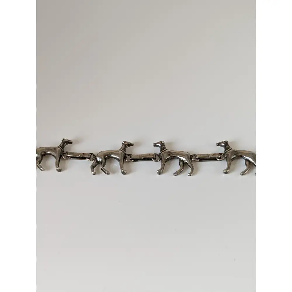 Silver steed greyhound silver bracelet crafted with four linked greyhound figures in sleek silver finish