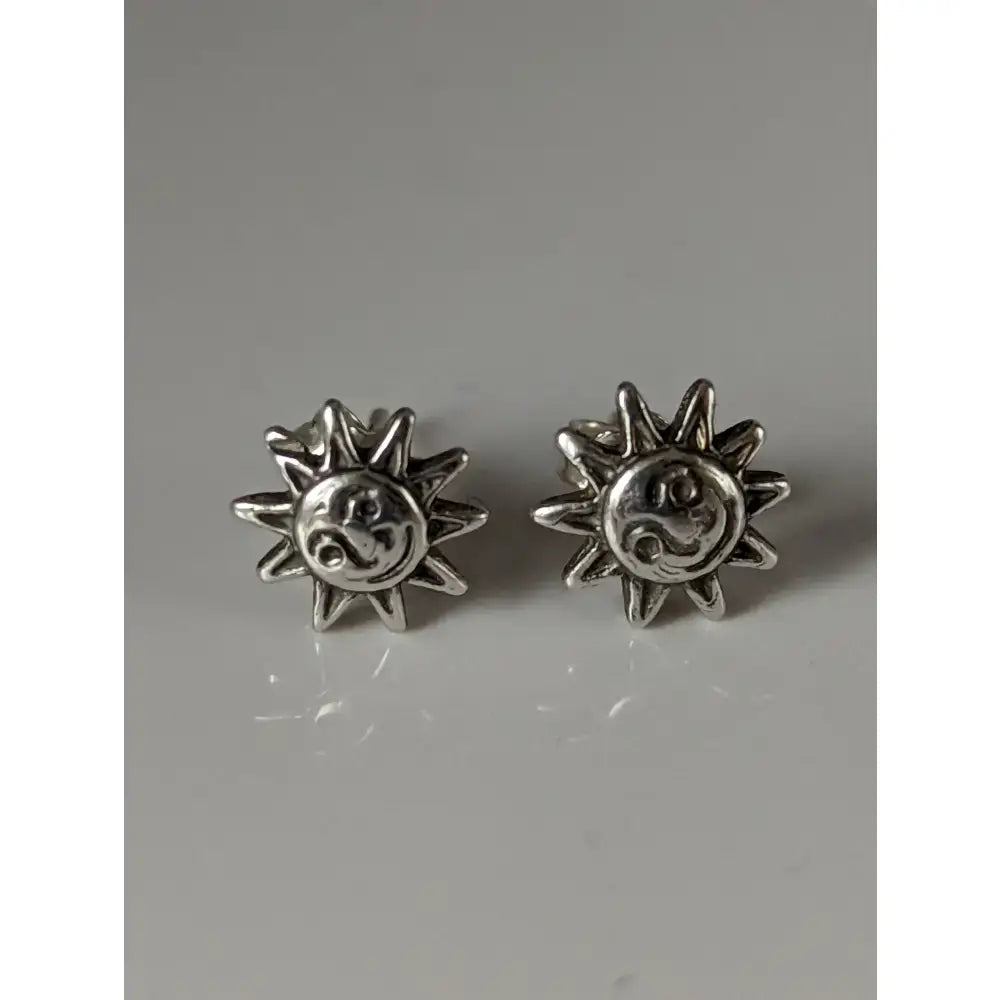 Silver steed happy sun stud earrings featuring silver sun stud earrings with a smiling face and radiating rays