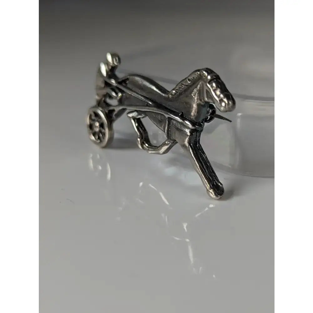Silver steed harness racing trotter horse brooch in polished silver with intricate detailing and metallic finish