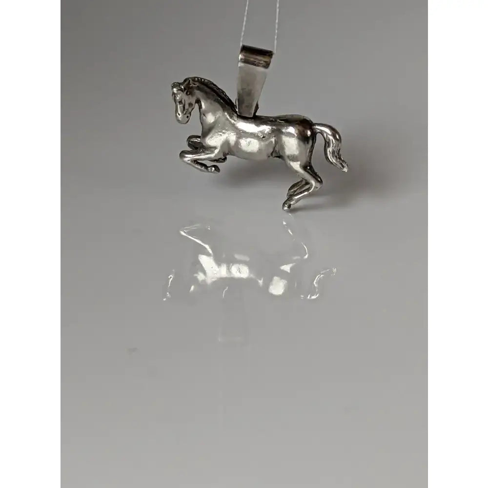 Silver steed haute ecole pendant with polished silver finish and detailed sculpted equestrian horse design