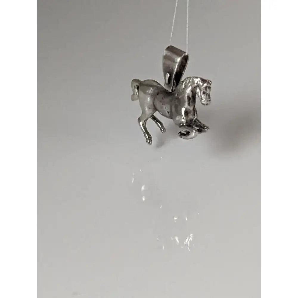 Silver steed haute ecole pendant featuring a detailed sculpted silver horse with polished metallic finish equestrian pendant