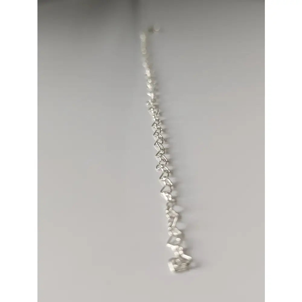 Silver steed heart link bracelet with interlocking heart-shaped links in shiny sterling silver design