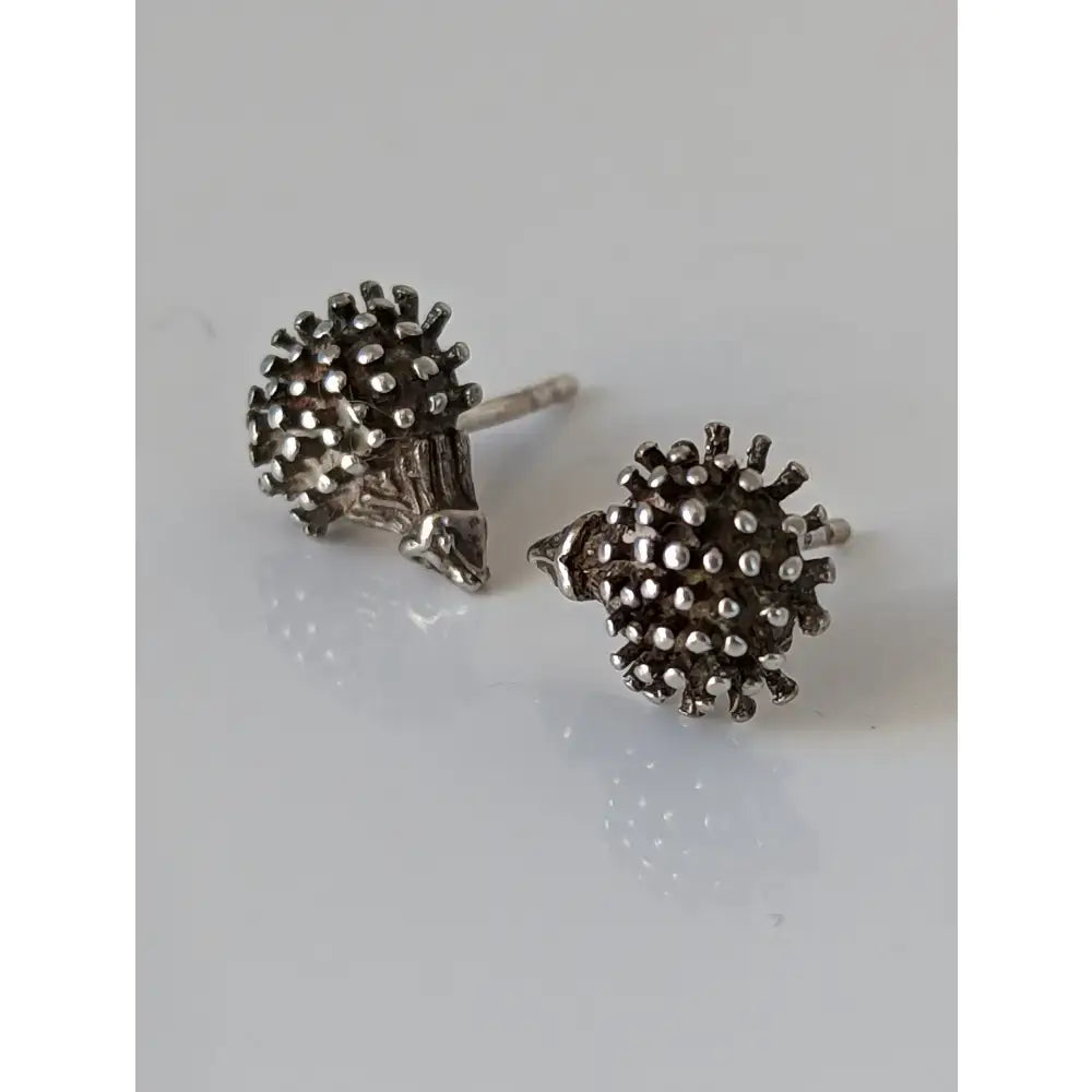 Silver steed sterling silver hedgehog stud earrings with detailed spines and textured metallic finish