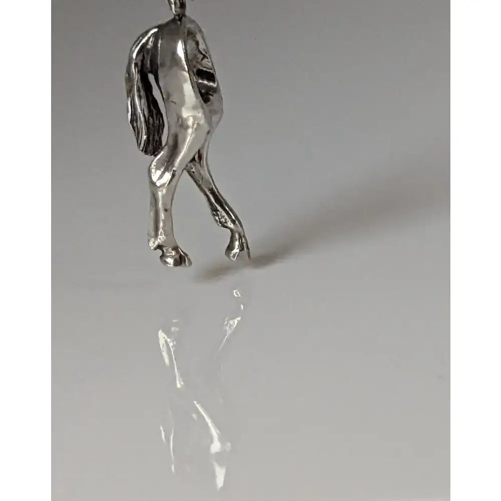 Silver steed hindquarters sterling silver pendant with detailed sculpted legs and flowing mane design