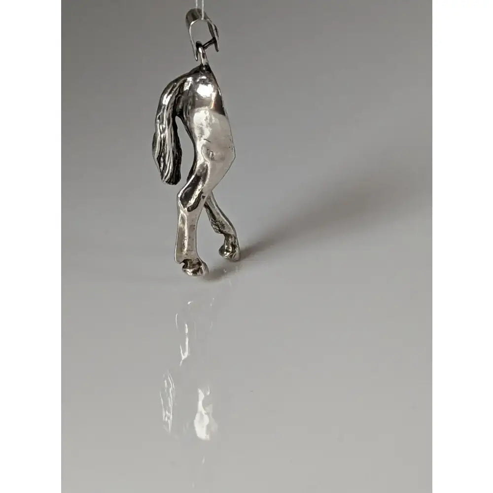 Silver steed hindquarters sterling silver pendant with detailed sculpted mane and polished metallic finish