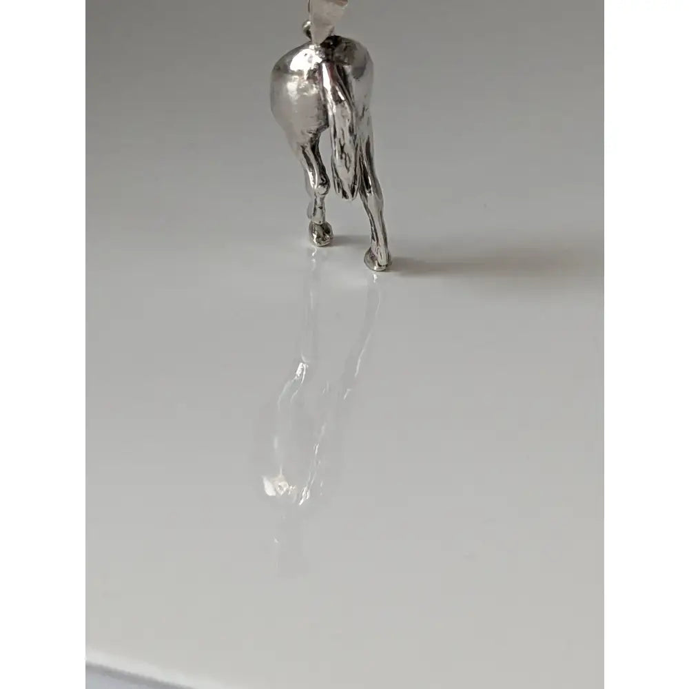 Silver steed hindquarters sterling silver pendant with polished metallic finish and detailed horse sculpting